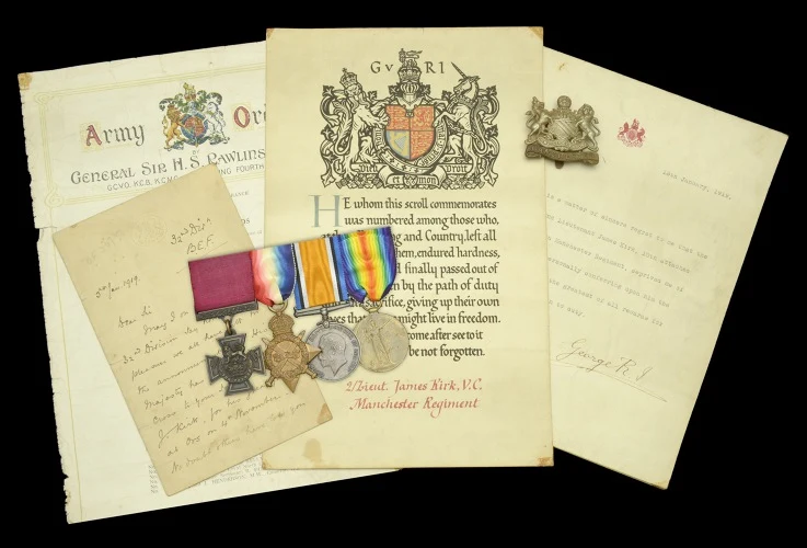 Second Lieutenant James Kirk's Victoria Cross and campaign medals with his memorial scroll, a letter signed by King George V and his Manchester Regiment cap badge, as released by the auction house.