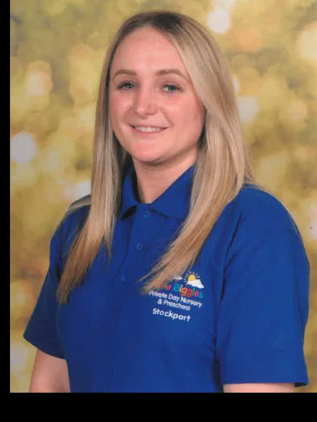 Sionade Wagstaff, smiling, in a blue Little Giggles polo shirt